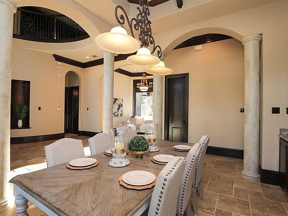 Lovely arches and columns define this dining room