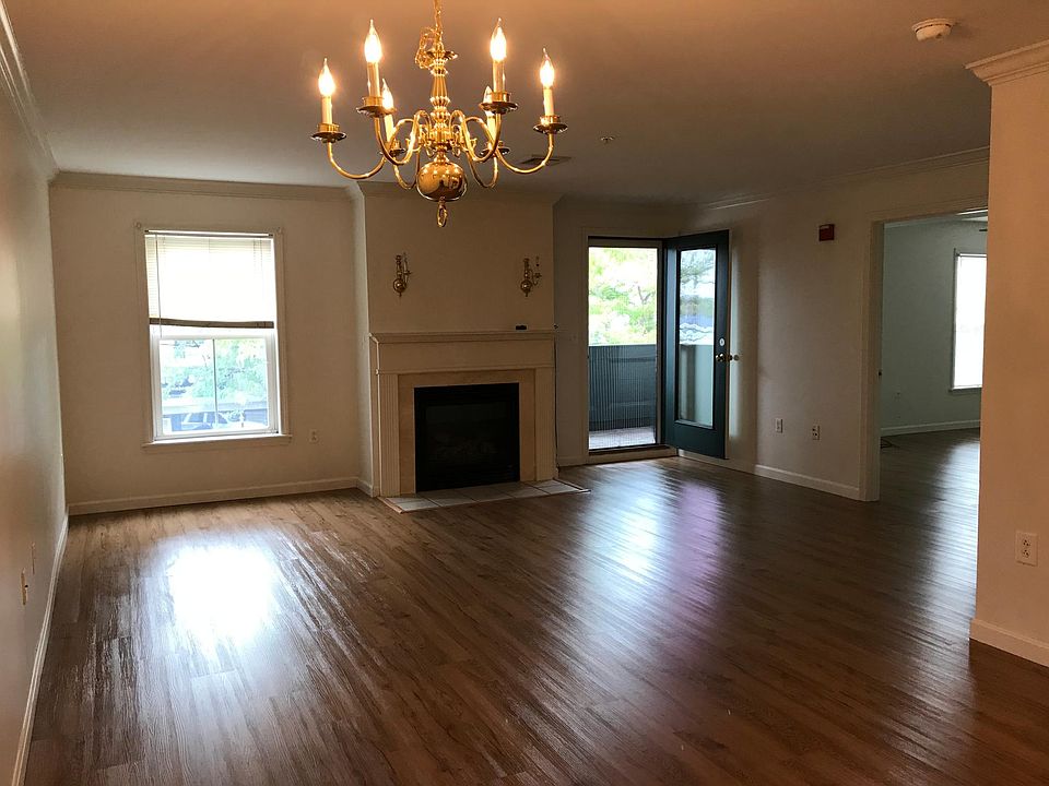 Living room with gas fireplace and walk-out to private patio