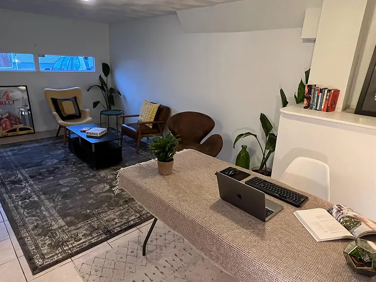 Fully operational garage with new door; current tenants use it as an additional living space.
