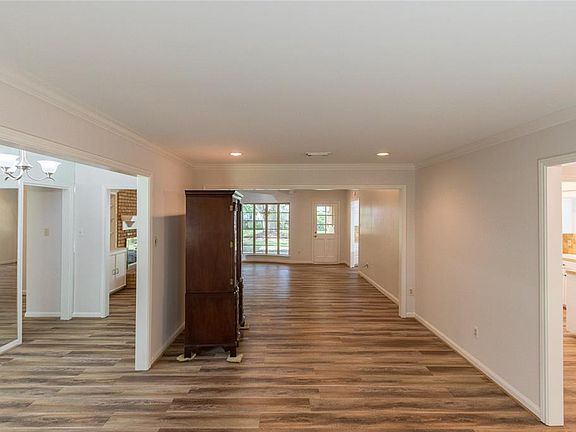 The wall between the formal living room and family room was removed providing flexible opportunities for this space
