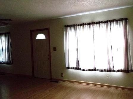 Large living room with ceiling fan