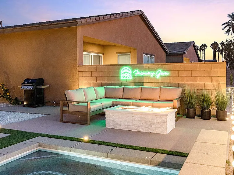 Enjoy conversation with your loved ones by the outdoor fire pit.