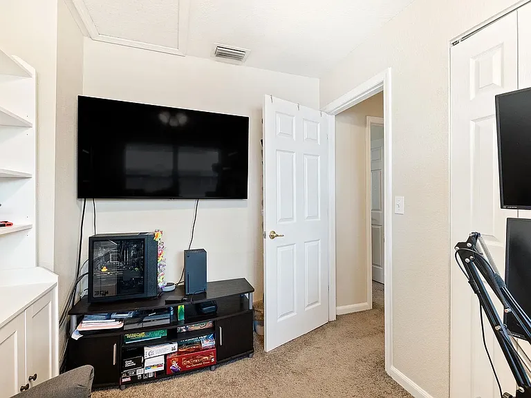 Secondary Bedroom *NOTE: floors have been updated with new laminate flooring, not pictured*