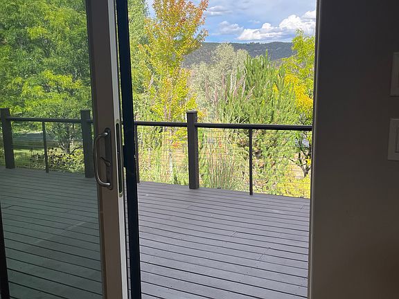 Sliding door from living area to deck and terraced yard