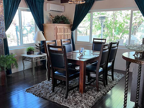 This area is right adjacent to the photo with the leather couch and TV.