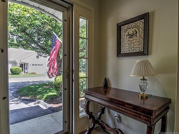 Pretty ceramic tile foyer welcomes you into this meticulously kept unit!