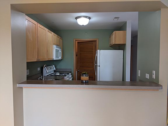 Breakfast bar looking into kitchen from dining area.
