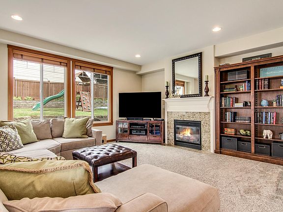 Family room adjacent to dining room and kitchen. Overlooks the backyard.