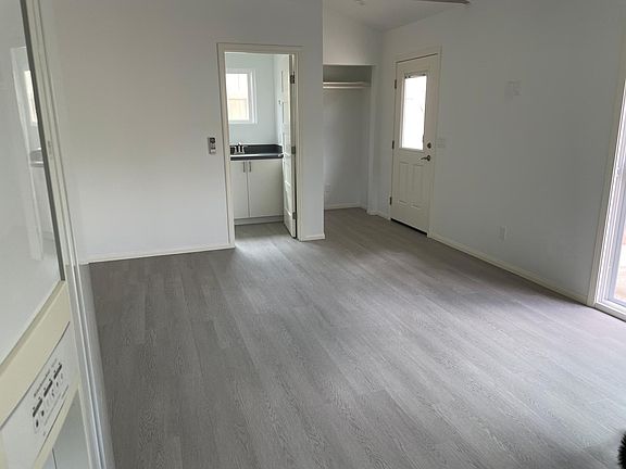 From kitchen looking towards full bath and front door