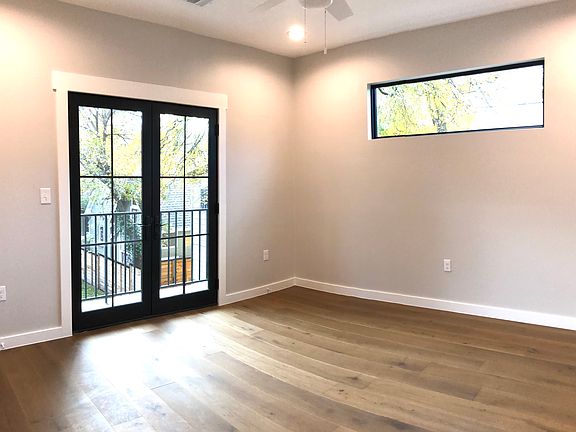Primary bedroom leads out to a balcony