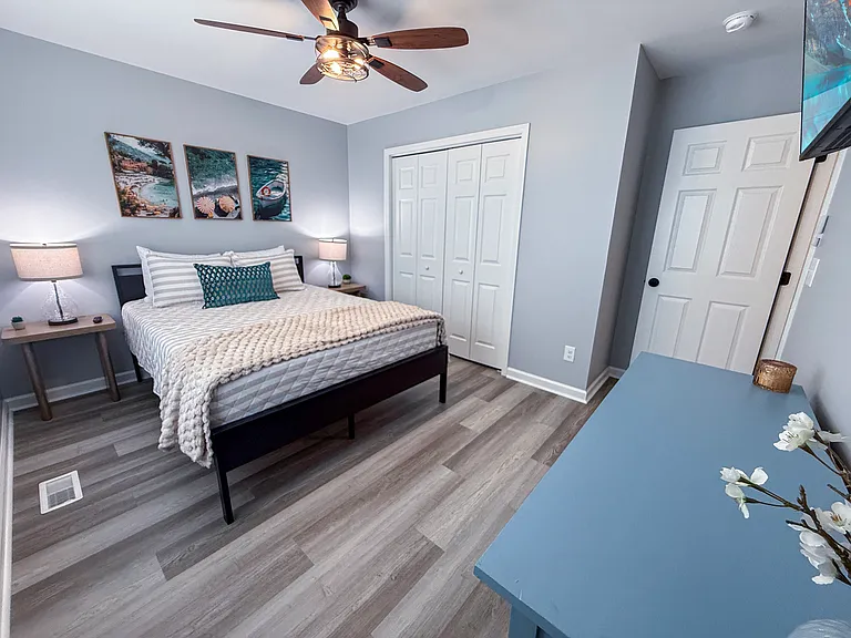 Queen Bedroom 2 with plush linens, dresser and closet for clothing storage