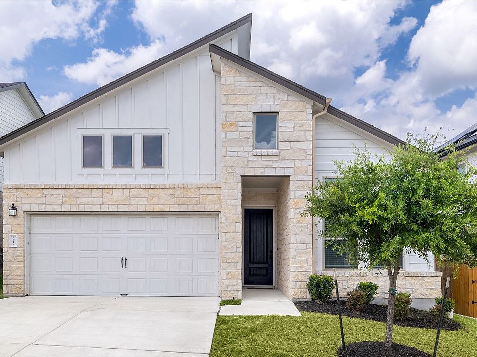 Front of home. Large 2 car garage