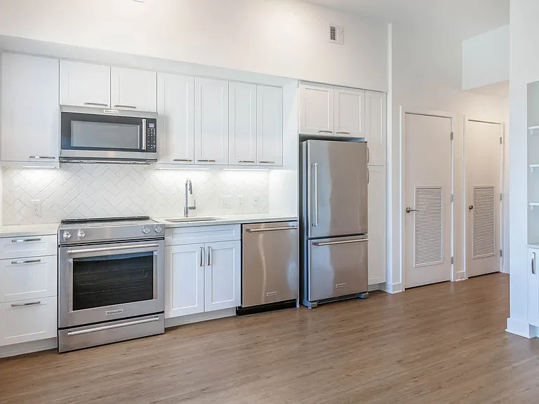 Kitchen with Stainless Steel Appliances and Quartz Countertops