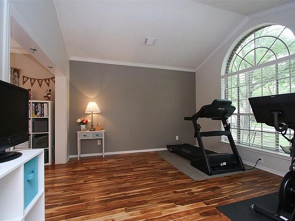 This lovely study or formal dining room is nice and bright and sunny with its oversized window and tall ceiling.   This home truly has a laundry list of recent updates that include the flooring, paint, roof, completely revamped kitchen, pool equipment, outdoor lighting, and so on.  MOVE IN READY for sure!