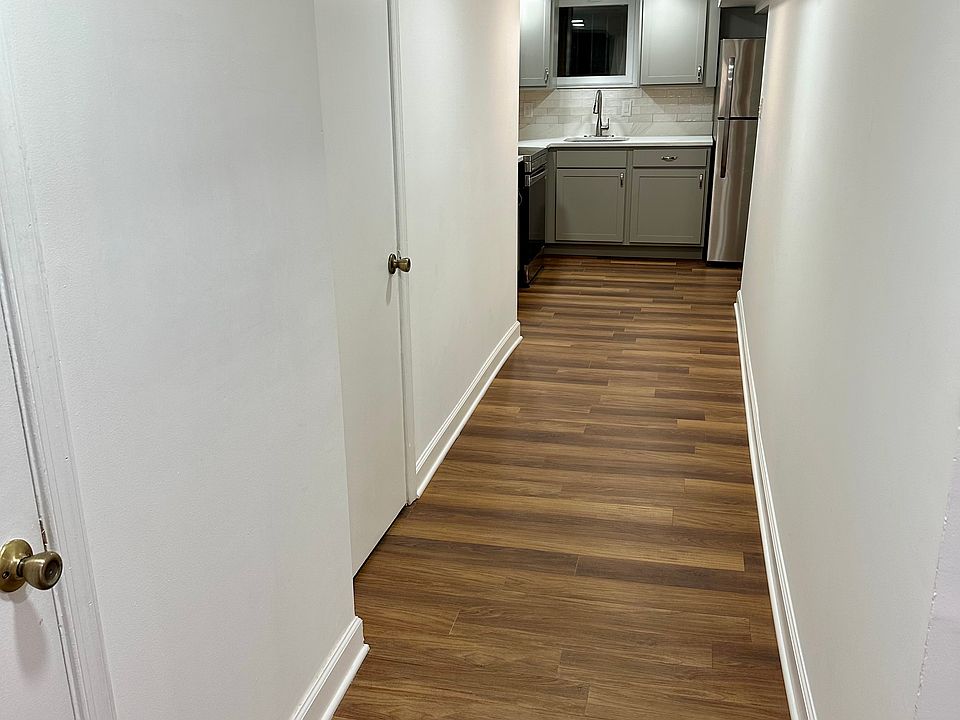 Hallway with hardwood flooring