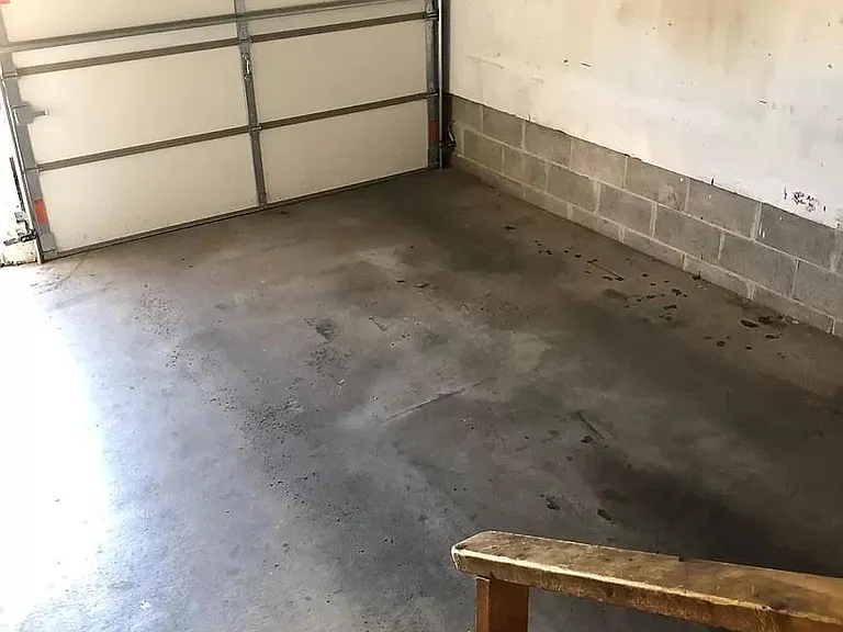 Single car garage with built in shelving for extra storage