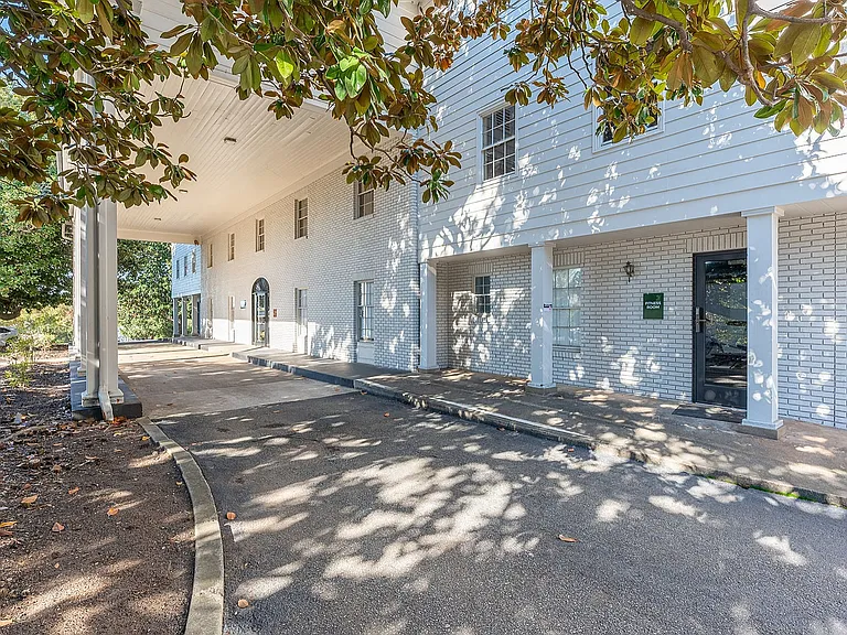Experience the inviting charm of this elegant apartment entrance, offering style and tranquility.