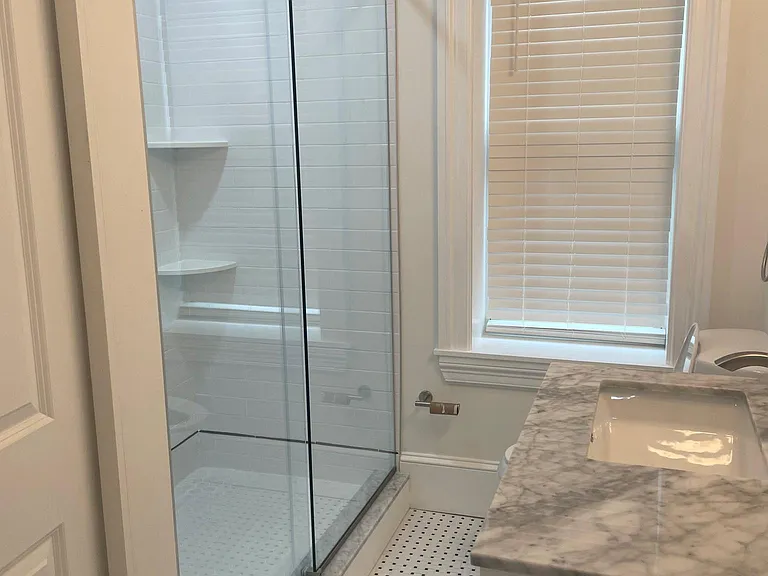 Bathroom with a large walk-in shower.