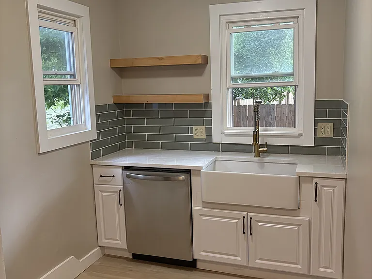 Kitchen - New cabinets, tile backsplash, farmhouse sink, and dishwasher