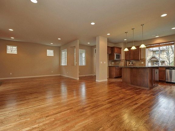 Open concept living area, dining and kitchen