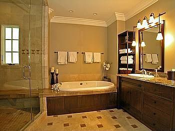 Master bath with huge stone steamshower, jacuzzi tub, double walnut vanity