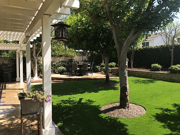 Enjoy the beauty of park like backyard with mature Carrottwood and Crepe Myrtle Trees. Enjoy outdoor dining year round with two patio sets each with fire bowls.