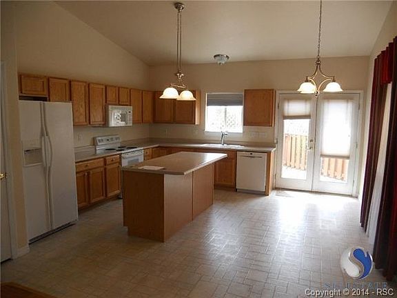 Kitchen with walkout deck.
