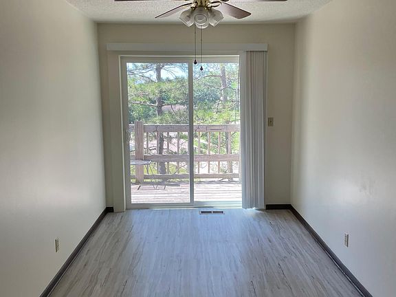 Dining room off the kitchen leading to shared balcony