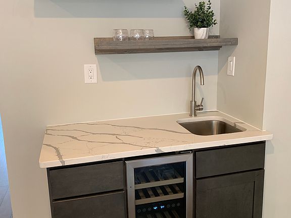 Wet bar with sink and fridge