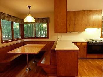A cozy breakfast nook with built in horseshoe banquette.