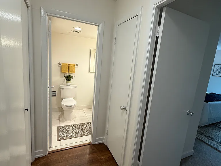 Bathroom entrance next to linen closet