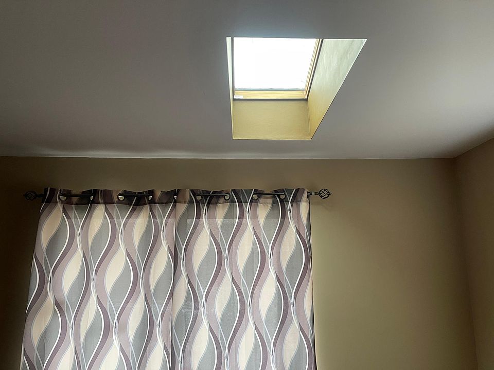 living room with skylight.