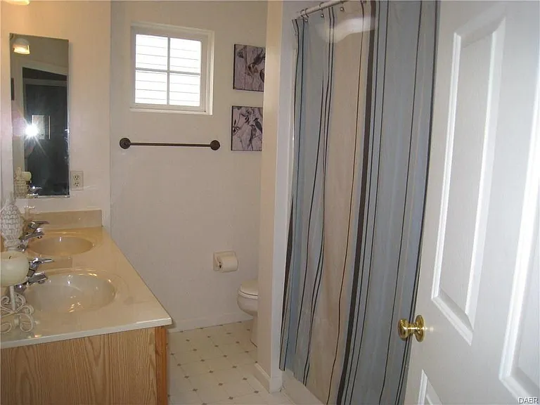 This owner's suite bath is comfortable for 2 people, but won't take long to clean! Double sink vanity allows everyone to get ready at the same time!