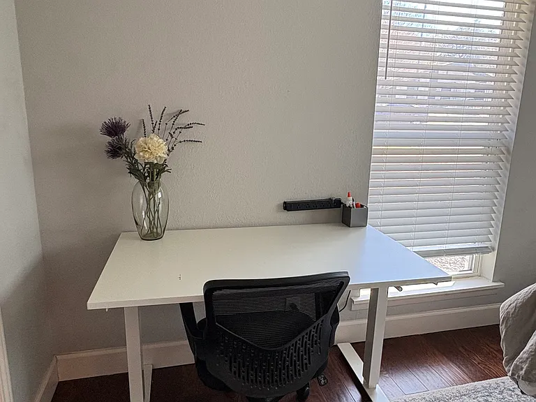 Primary suite includes this desk that can be raised to standing level.