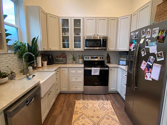 New appliances, farmhouse sink and custom cabinetry