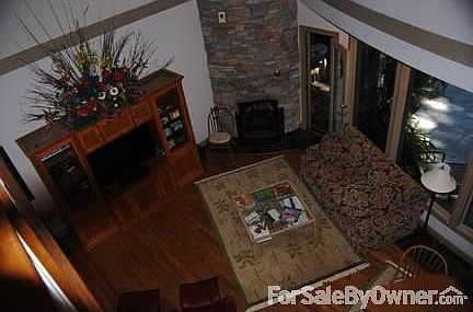 Gathering Room off Kitchen
						:
						Hardwood floors, stone wood burning fireplace, access to sunroom