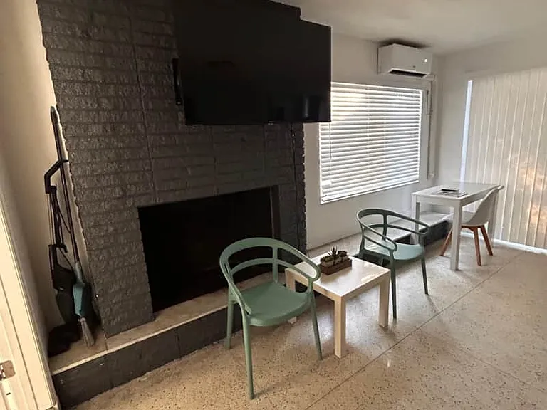 Modern cozy fireplace with seating, desk and workspace chair