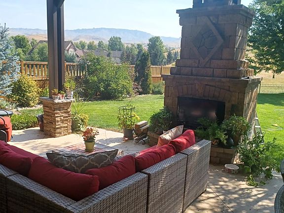 covered patio with fireplace. Amazing views of the foothills.