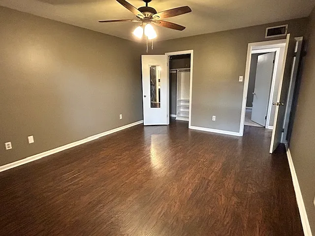 Master Bedroom with Hardwood Floor and a walk-in closet