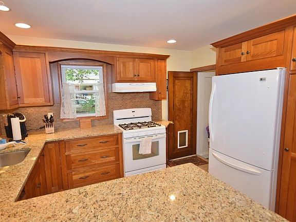 Beautiful kitchen with granite counters and cherry cabinets!