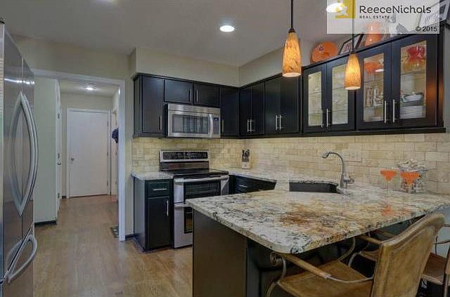 New custom cabinets, travertine backsplash and granite tops
