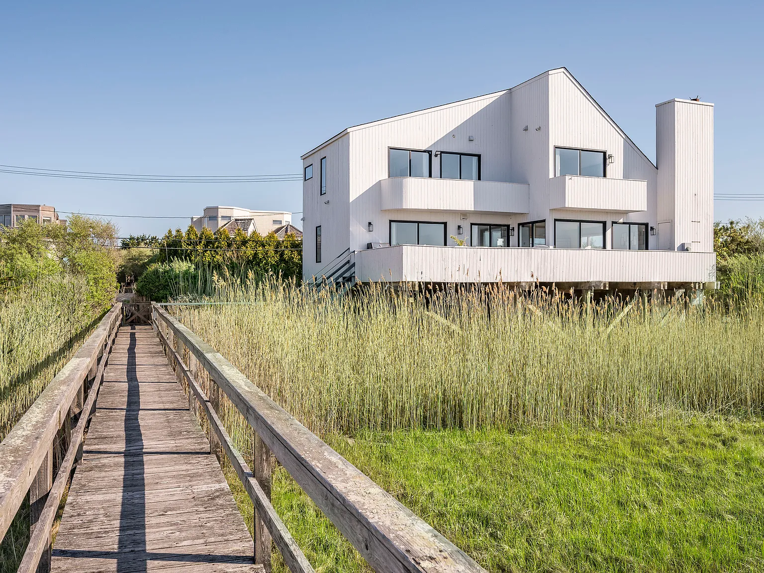 Dune Rd Waterfront | Dock, Beach Access, Sunset Views — Photo 3