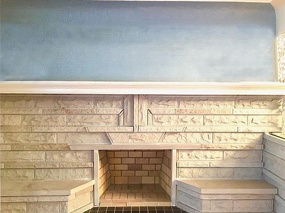 living room wood burning stone fireplace is one of a kind. Absolutely gorgeous