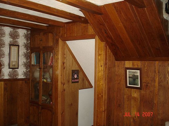 Wormy chestnut bookshelf and rafters
