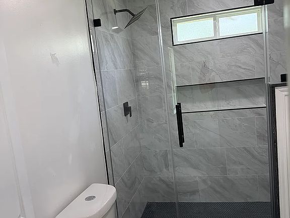 master bath, natural light, dual sinks, modern fixtures, shower bench