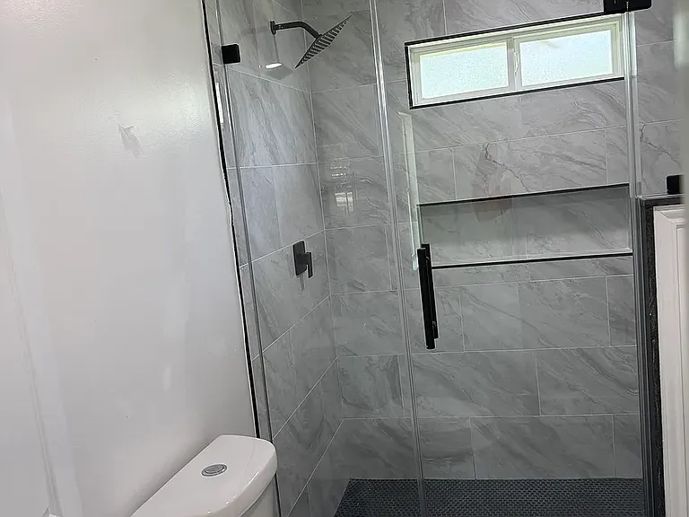 master bath, natural light, dual sinks, modern fixtures, shower bench