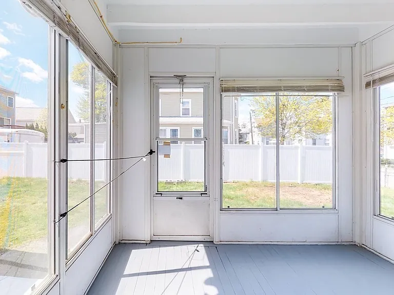 Dedicated, non-shared back porch. Windows open and close. Great for sitting space and plants! (Path must be clear for upstairs unit to exit)