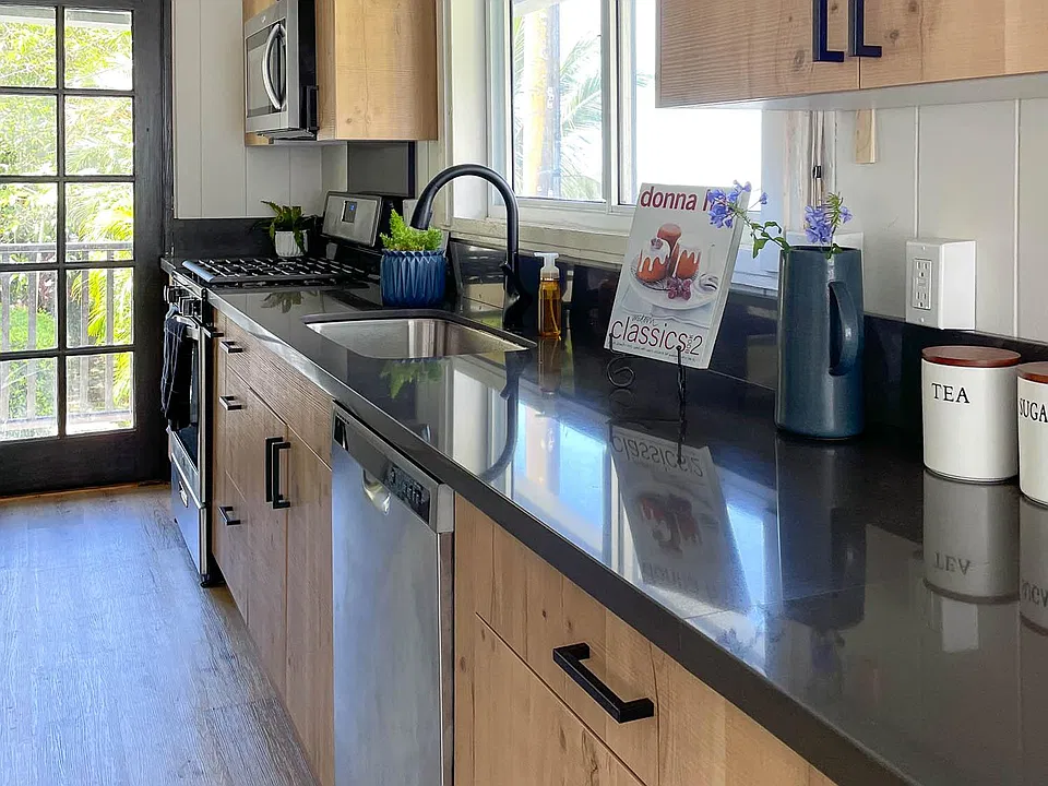 New kitchen with quartz countertop. Lots of prep space and gas stove/oven for those who love cooking.