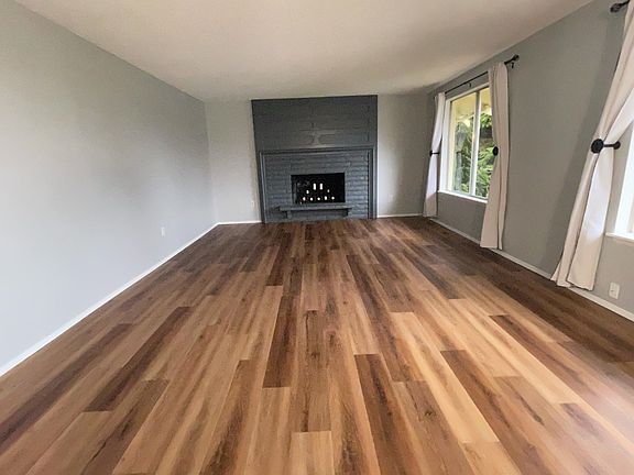 Large living room with new LVP floors and Freshly painted.