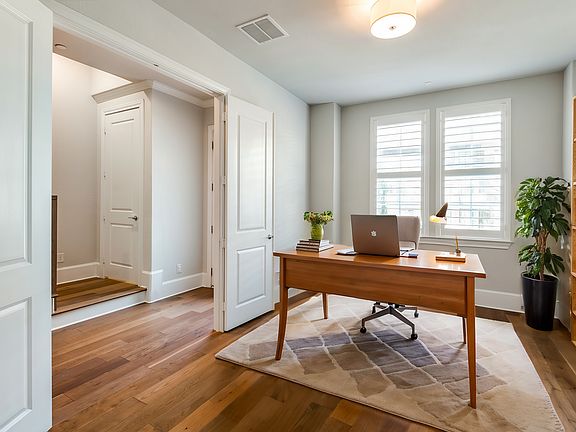 Home office or guest bedroom on floor has been virtually staged for layout and design.
